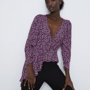 Pink and purple floral blouse with deep v neck and single side high low ruffle